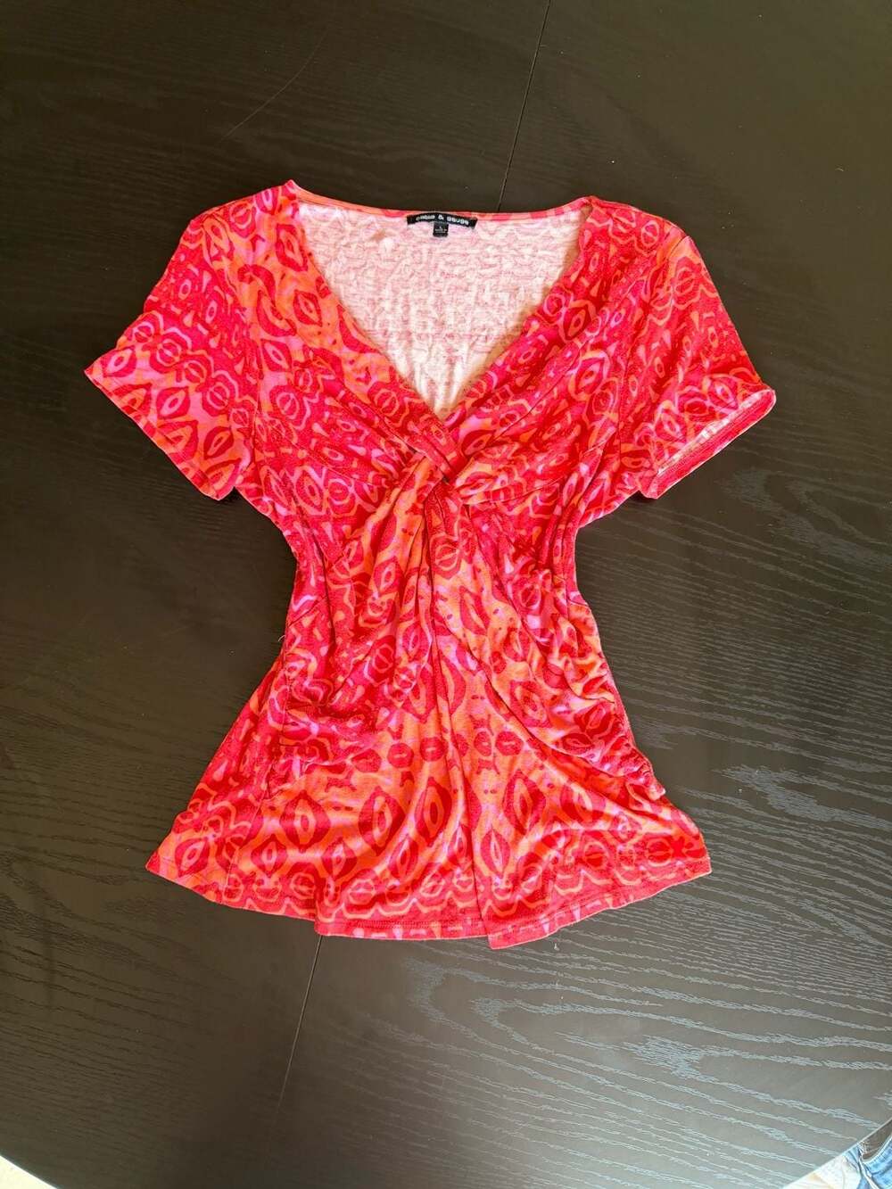 Cable & Gauge Red and Orange Tribal Print Twist Front V-Neck Top
